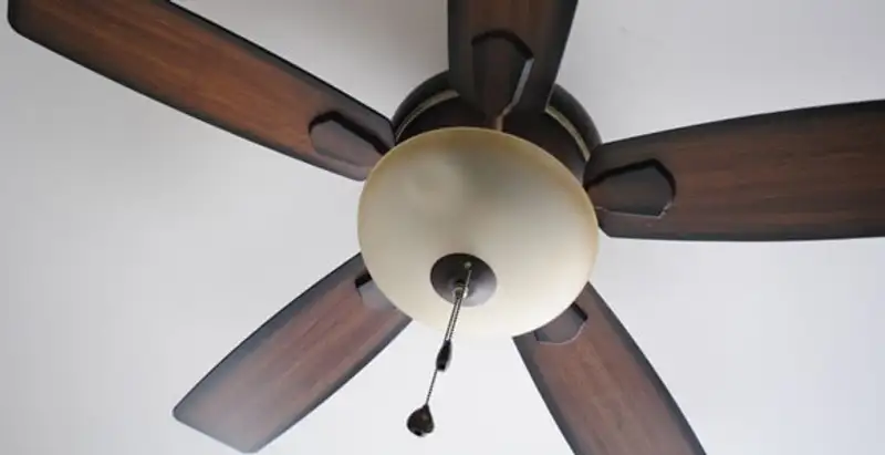 Fully installed ceiling fan with balanced blades and light fixture in Modesto, CA