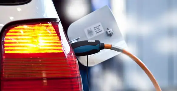 Electric car plugged into EV charger after professional installation in Modesto, CA