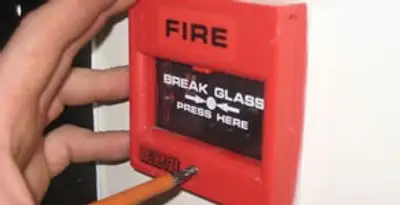 fire alarm installation service showing manual fire alarm pull station installed by licensed electricians in Modesto, CA