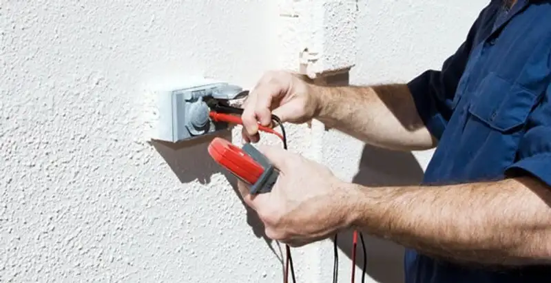 Electrician performing home electrical outlet and wiring inspection in Modesto, CA