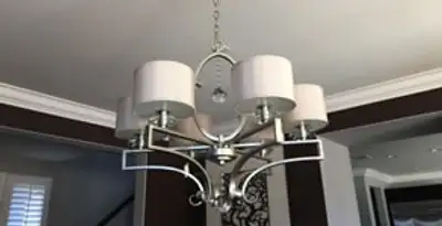 Modern chandelier installation with multiple light fixtures in Modesto, CA