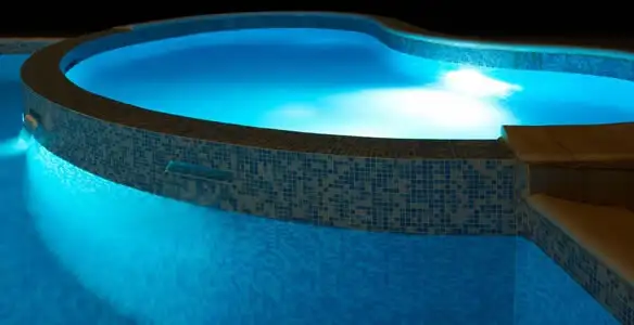 pool light installation and repair services highlighting illuminated pool interior lighting in Modesto, CA
