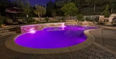 pool light installation and repair services illuminating a residential swimming pool in Modesto, CA