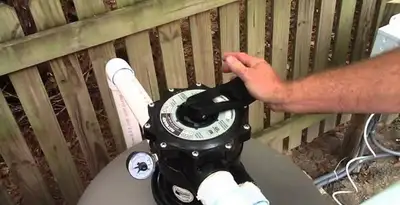 pool pumps service showing professional adjustment of pool pump control system in Modesto, CA