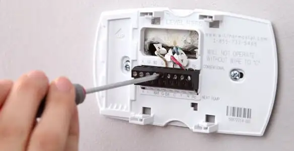Thermostat installation service with proper wiring and secure wall mounting in Modesto, CA