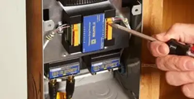 Whole home surge protection device being installed by a licensed electrician to protect electrical systems in Modesto, CA